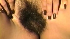 Exotic and sensual Nina spreads her legs and shows off her hairy cunt