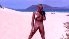 Tanned guy on beach in tiny string thong (temporarily!)