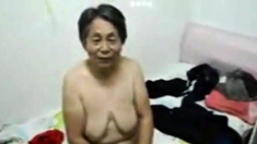 Asian Grandma get dressed after sex